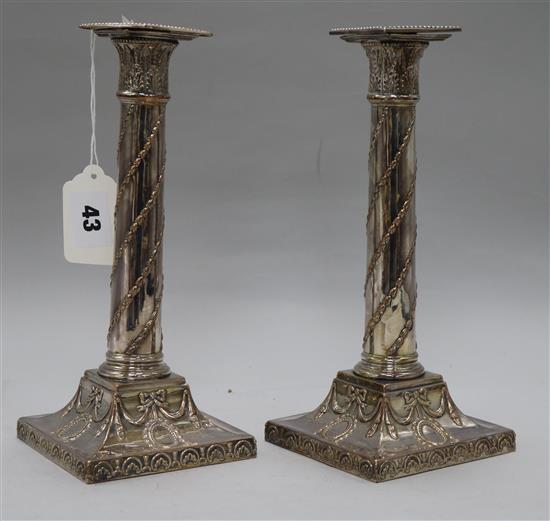 A pair of 18th century plated candlesticks